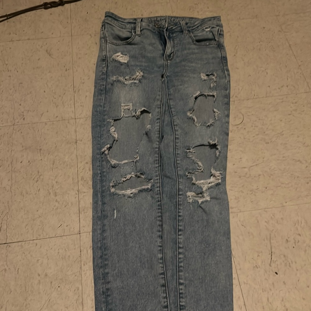 Light blue ripped jeans size 4 and the brand is from American eagle